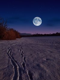 Scenic view of moon against sky at night