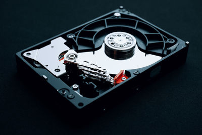 High angle view of camera on table against black background