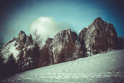Vintage effect of breathtaking winter panorama of dolomite walls at sunset
