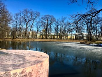 Scenic view of lake against sky during winter