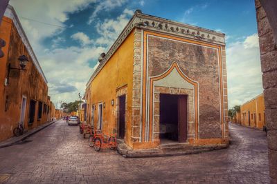 City street against cloudy sky