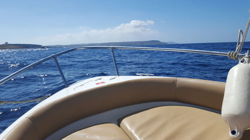 Sailboat sailing in sea against sky