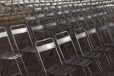 Close-up of chairs on table