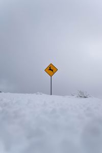 Scenic view of snow covered field against clear sky