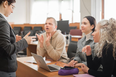 Business colleagues working at office