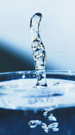 Close-up of water splashing against white background