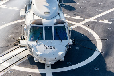 High angle view of airplane on airport runway