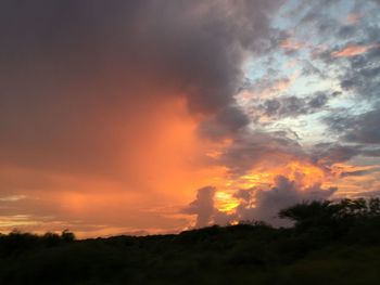 Scenic view of dramatic sky during sunset