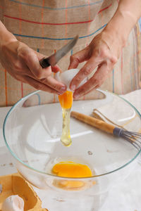 Cropped hand of person preparing food