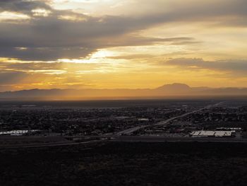 Scenic view of dramatic sky at sunset