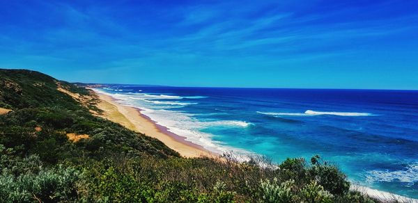 Scenic view of sea against blue sky