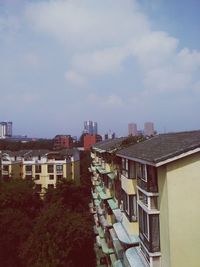 Buildings in city against sky