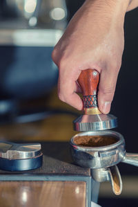 Close-up of hand holding wine glass