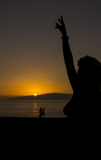 Scenic view of sea at sunset