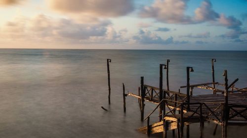 Scenic view of sea against cloudy sky