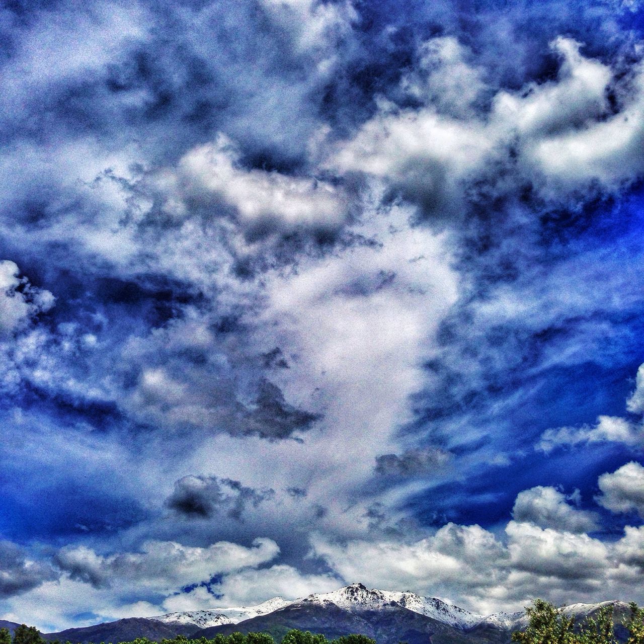 sky, cloud - sky, scenics, tranquility, beauty in nature, tranquil scene, blue, cloudy, nature, low angle view, cloudscape, weather, cloud, idyllic, landscape, majestic, outdoors, dramatic sky, day, white color