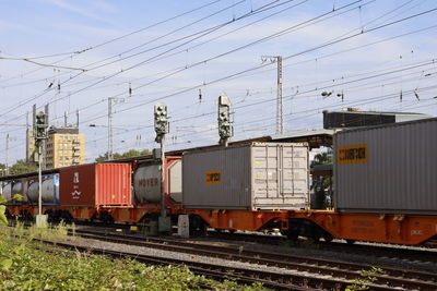 Train on railroad track against sky