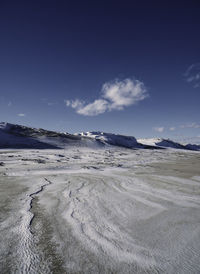 Scenic view of landscape against sky during winter