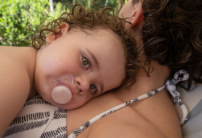 Portrait of cute baby girl lying down