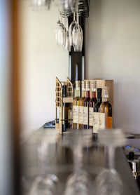 View of wine bottles on shelf in kitchen