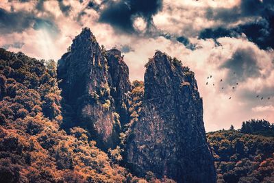 Low angle view of rocks against sky