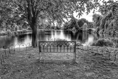 Gazebo by lake against sky