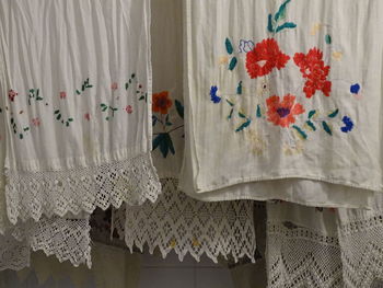 Close-up of white curtain hanging at home