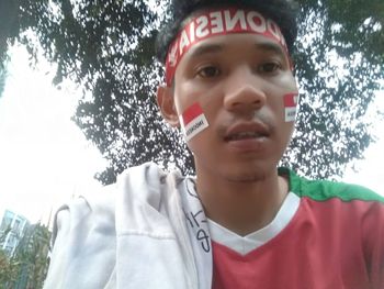Low angle view portrait of girl in park