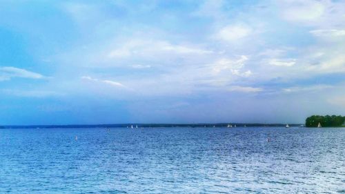 Scenic view of sea against cloudy sky