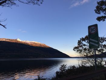 Scenic view of lake against blue sky