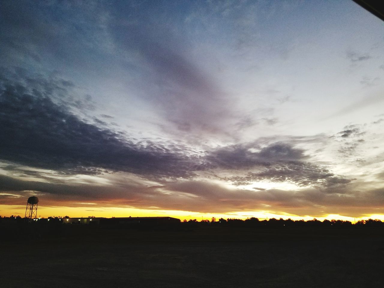 SILHOUETTE LANDSCAPE AGAINST CLOUDY SKY