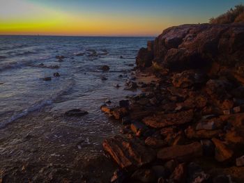 Scenic view of sea at sunset