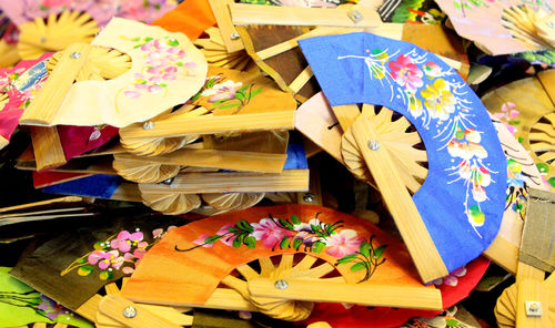 High angle view of multi colored hand fans