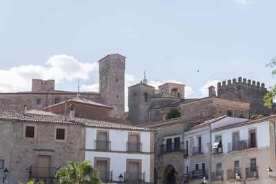 Buildings in city against sky