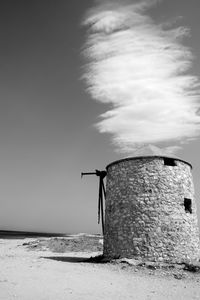 Traditional windmill against sky