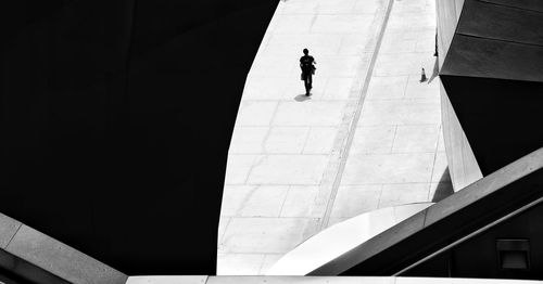 High angle view of woman walking in building