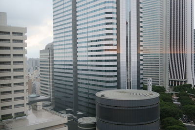 Modern buildings in city against sky