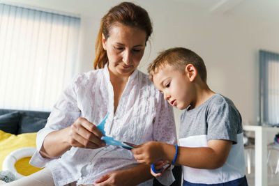 Mother and daughter looking at camera
