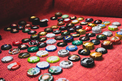 High angle view of colorful bottle caps on table