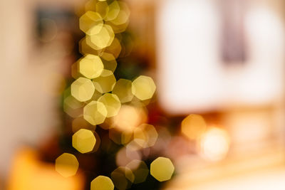 Defocused image of illuminated christmas tree