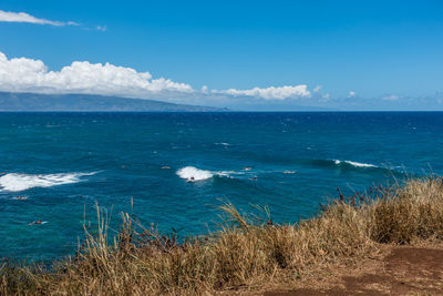 High angle view of sea against blue sky