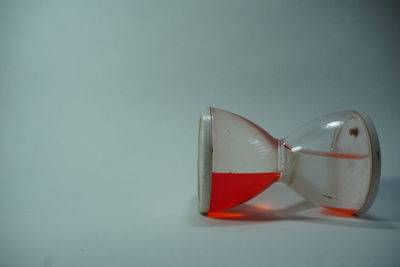 Close-up of red paint on table against wall