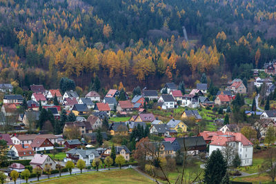 High angle view of houses and trees during autumn