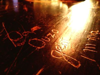 Close-up of illuminated lamp at night