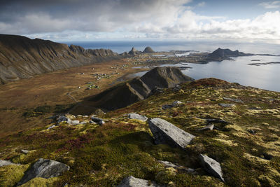 Scenic view of sea and rocks against sky in norway. a beautiful small island above the arctic circle