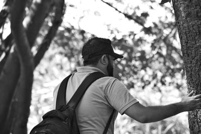 Rear view of man in forest