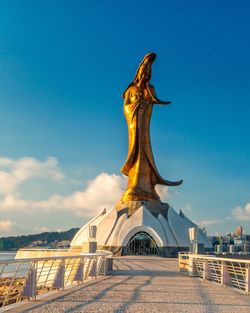 Statue of liberty against blue sky
