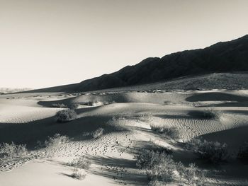 Scenic view of desert against clear sky