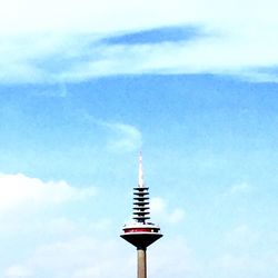 Low angle view of tower against blue sky