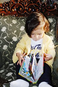 High angle view of cute boy sitting